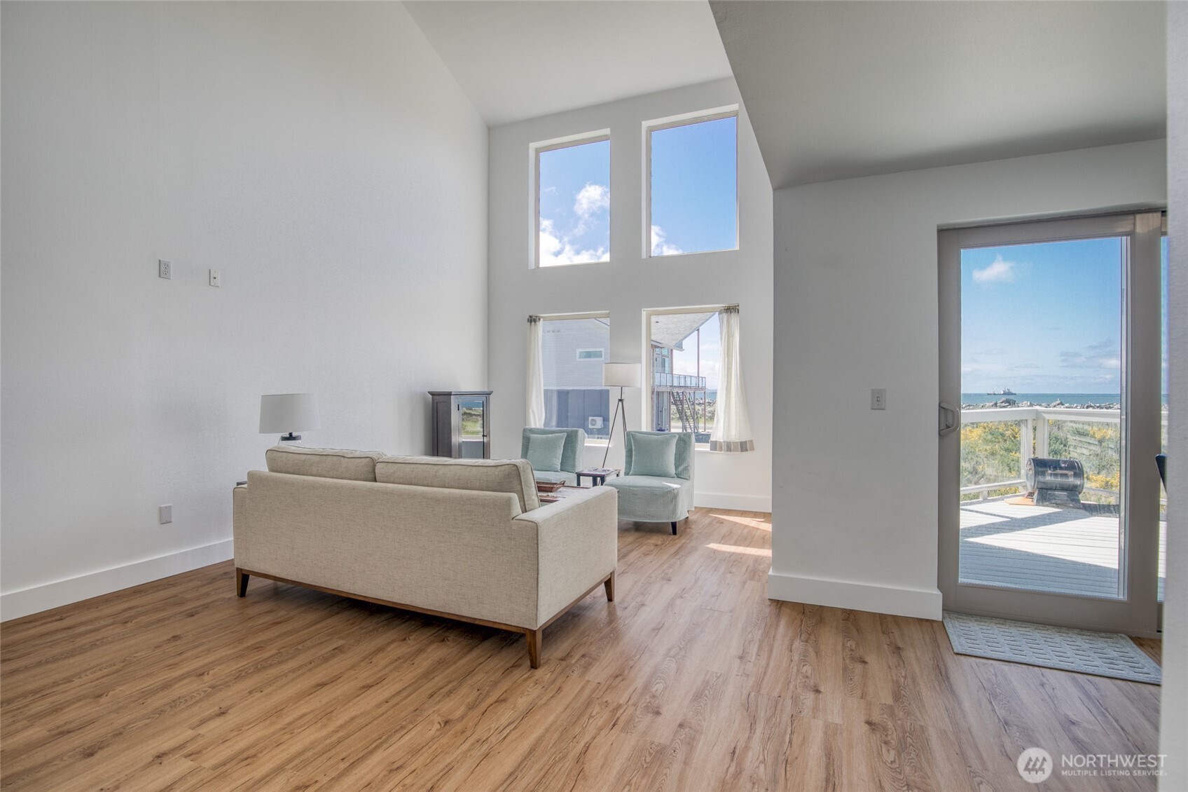 1472 Storm King Way Southwest, Unit A Ocean Shores, WA 98569 - Photo 9 of 39 a living room with furniture and a large window