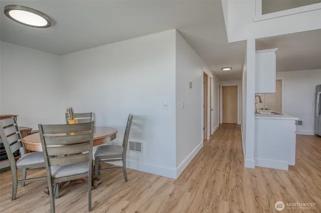 a living room with furniture and kitchen view