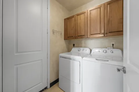a bathroom with a granite countertop sink double and mirror