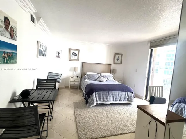 a view of a balcony dining table and chairs