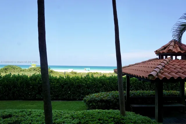 a view of a patio with table and chairs potted plants with wooden floor