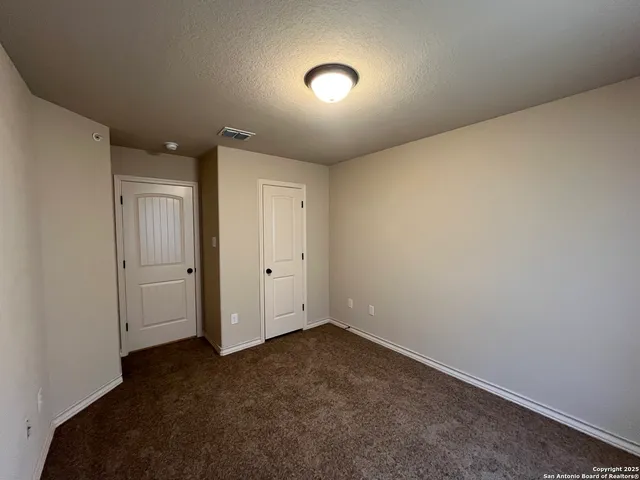 an empty room with a empty space and a window