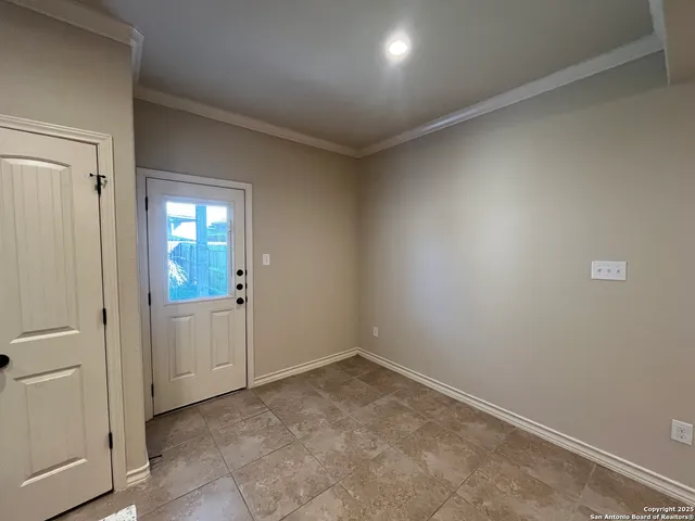 a view of an empty room and window