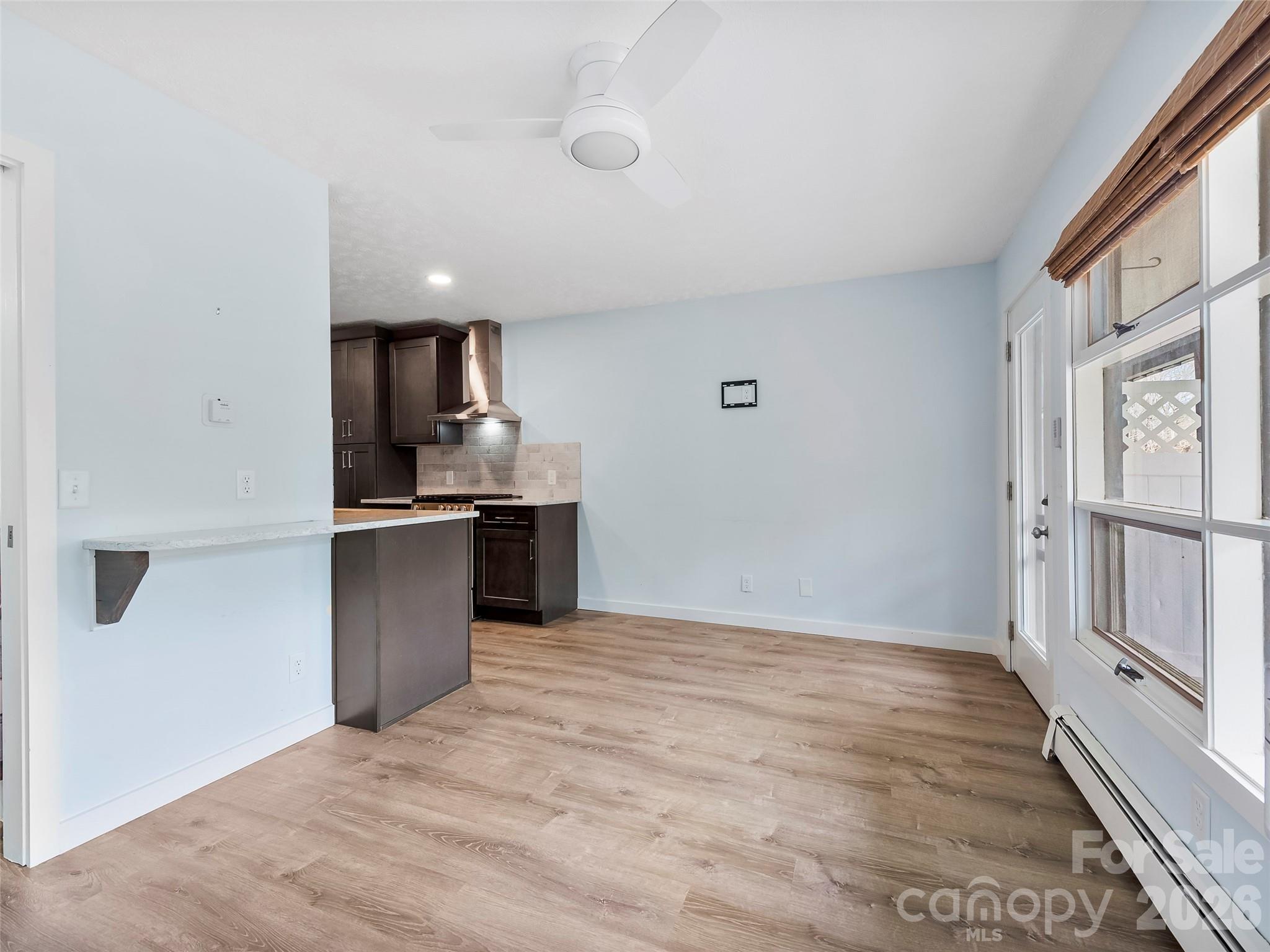 130 Old Mill Road, Unit 223 Flat Rock, NC 28731 - Photo 12 of 24 a kitchen with granite countertop a sink and a stove top oven
