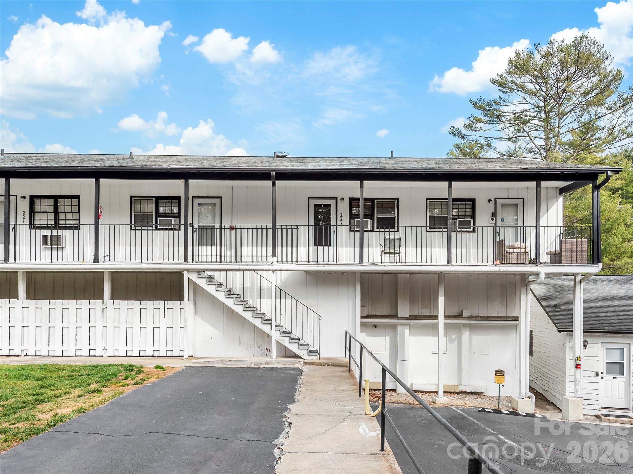 130 Old Mill Road, Unit 223 Flat Rock, NC 28731 - Photo 19 of 24 a front view of a house with large windows