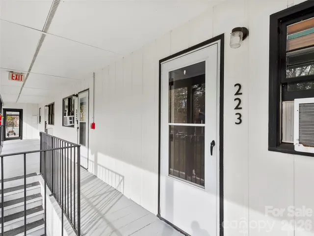 a view of a swimming pool with sitting area