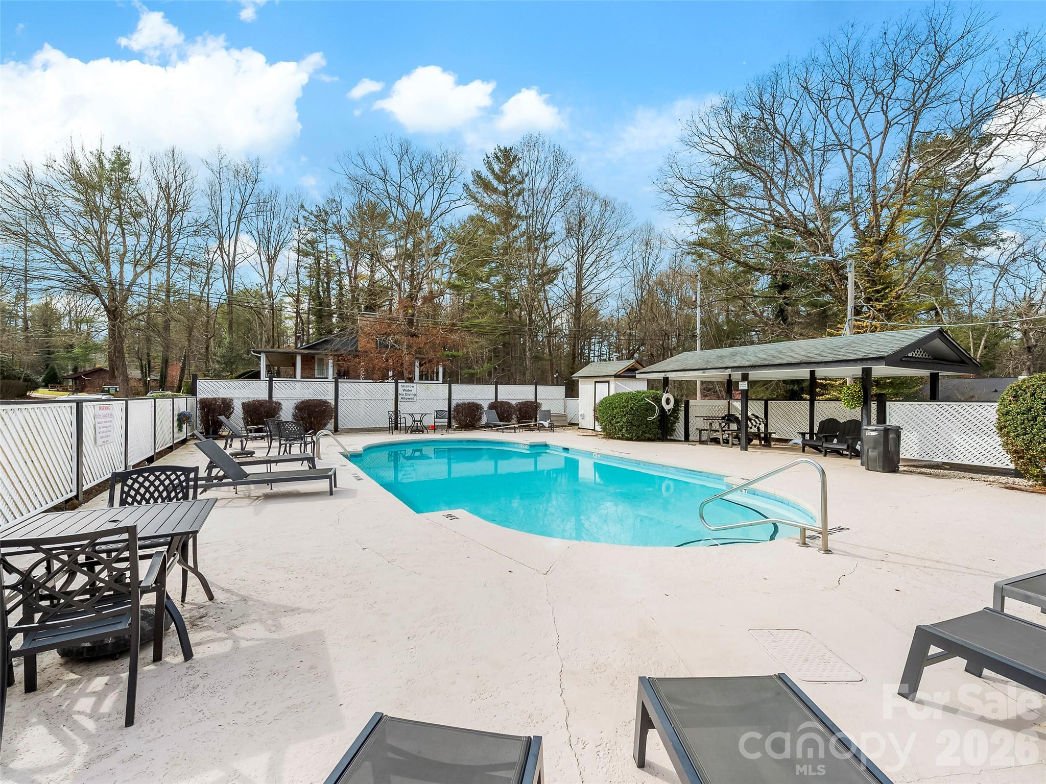 130 Old Mill Road, Unit 223 Flat Rock, NC 28731 - Photo 21 of 24 a view of a swimming pool with sitting area
