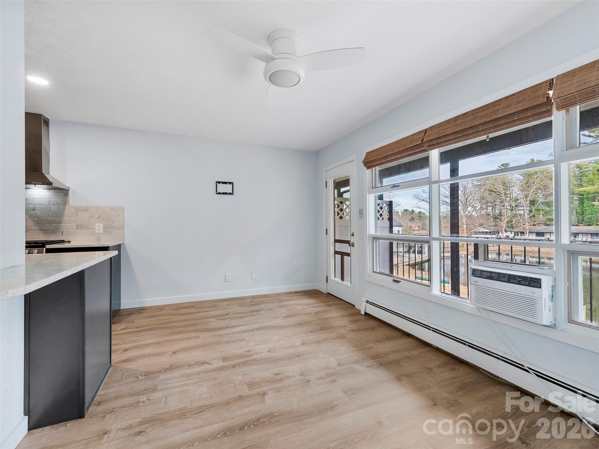 130 Old Mill Road, Unit 223 Flat Rock, NC 28731 - Photo 6 of 24 a view of an empty room with a window