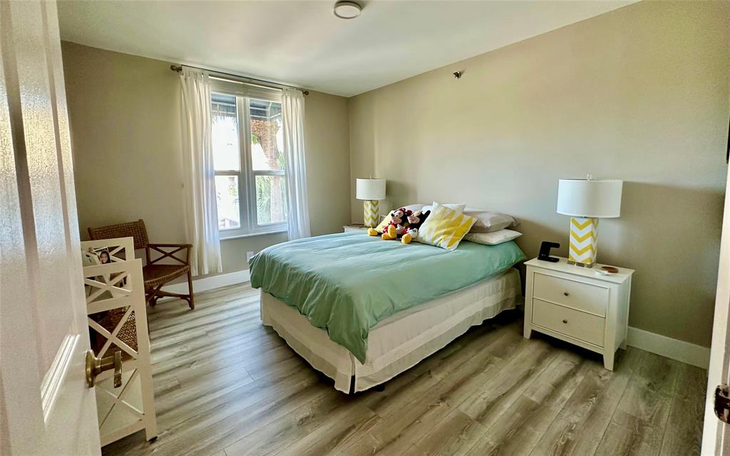 7582 Regency Lake Drive, Unit 301 Boca Raton, FL 33433 - Photo 13 of 20 a bedroom with a bed and a window