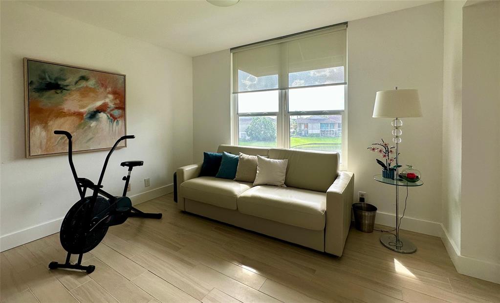 7582 Regency Lake Drive, Unit 301 Boca Raton, FL 33433 - Photo 16 of 20 a living room with furniture and a window