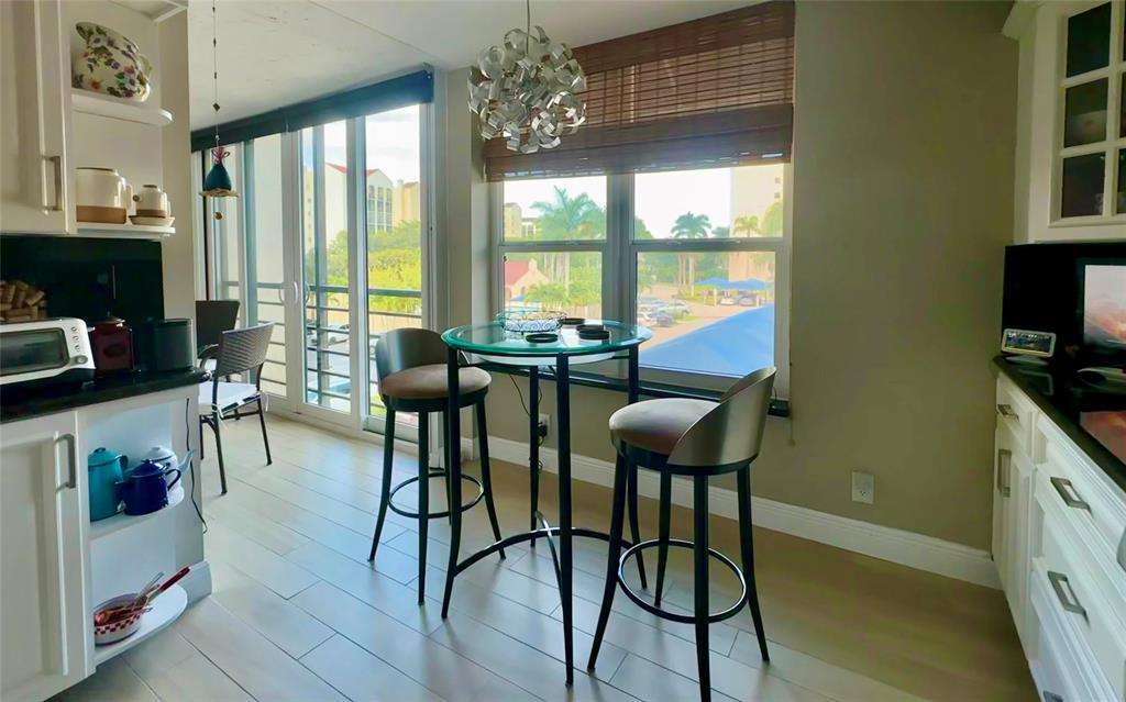 7582 Regency Lake Drive, Unit 301 Boca Raton, FL 33433 - Photo 20 of 20 a view of a livingroom with furniture window and outside view