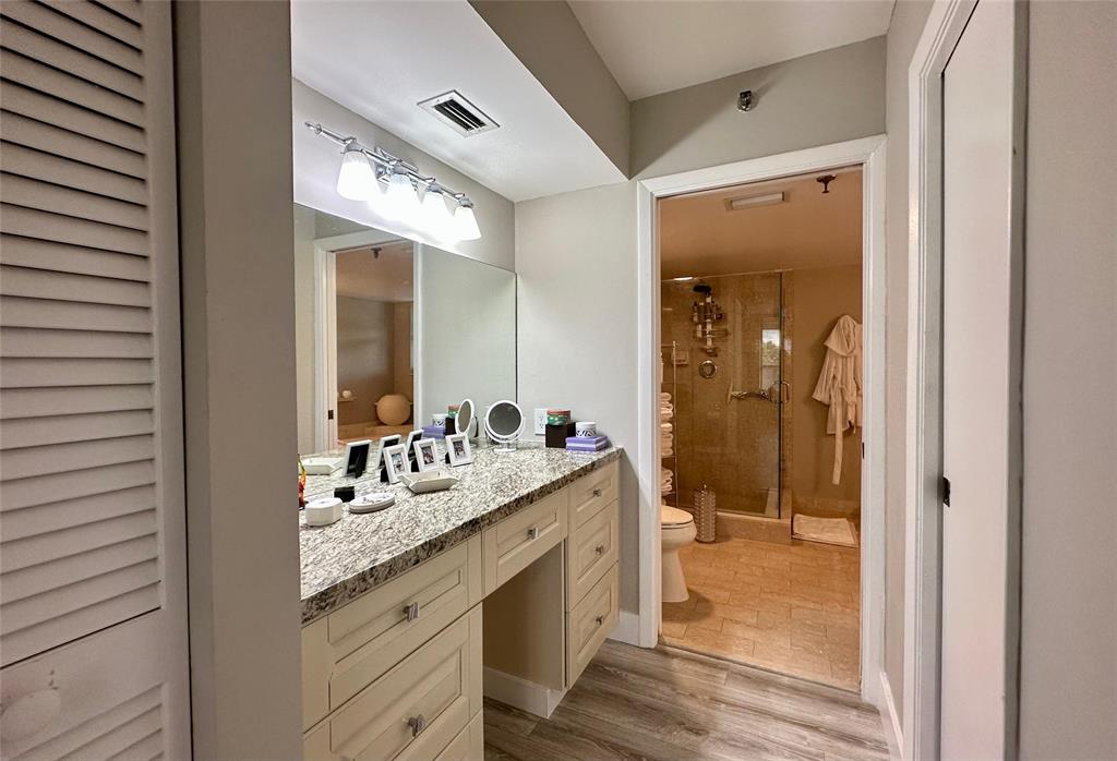 7582 Regency Lake Drive, Unit 301 Boca Raton, FL 33433 - Photo 10 of 20 a bathroom with a granite countertop sink mirror and a