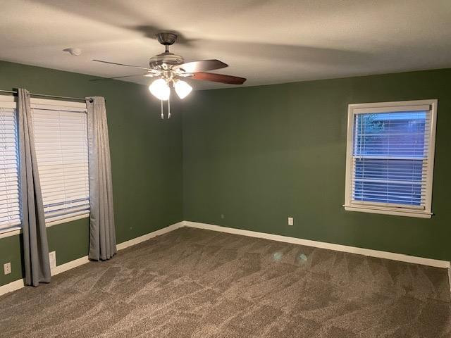 3018 32nd Street Lubbock, TX 79410 - Photo 16 of 33 a view of a livingroom with a chandelier fan and a window
