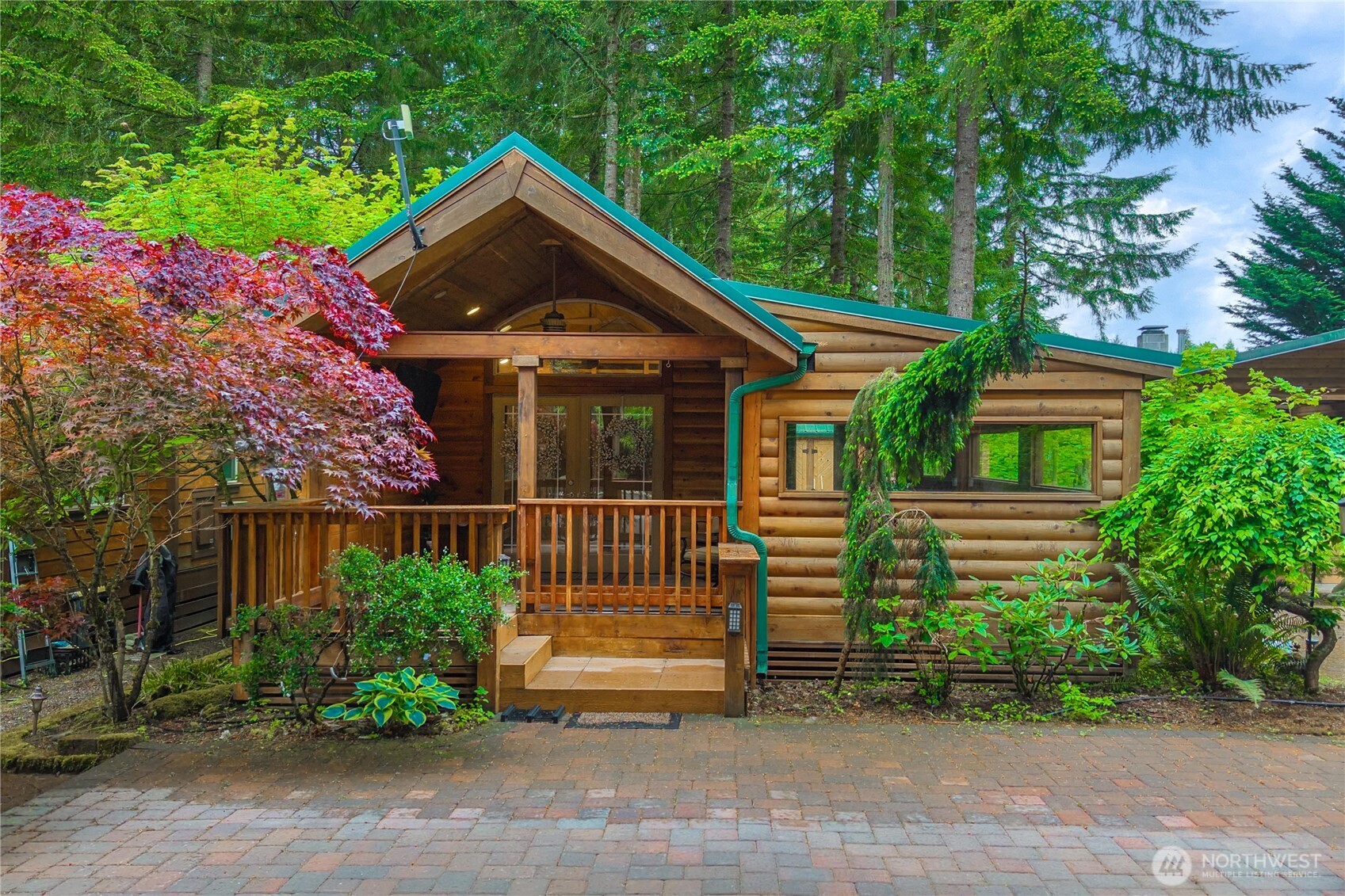 1546 Reservation Road Southeast, Unit 149 Olympia, WA 98513 - Photo 1 of 38 a front view of a house with a garden