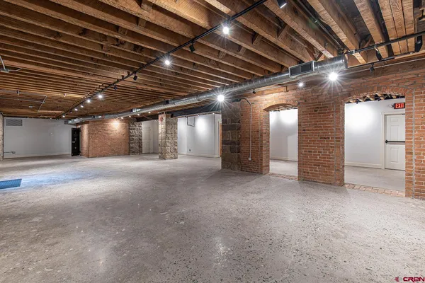 a view of empty room with wooden ceiling