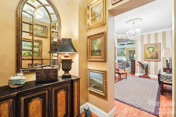 a living room with fireplace furniture and a large window