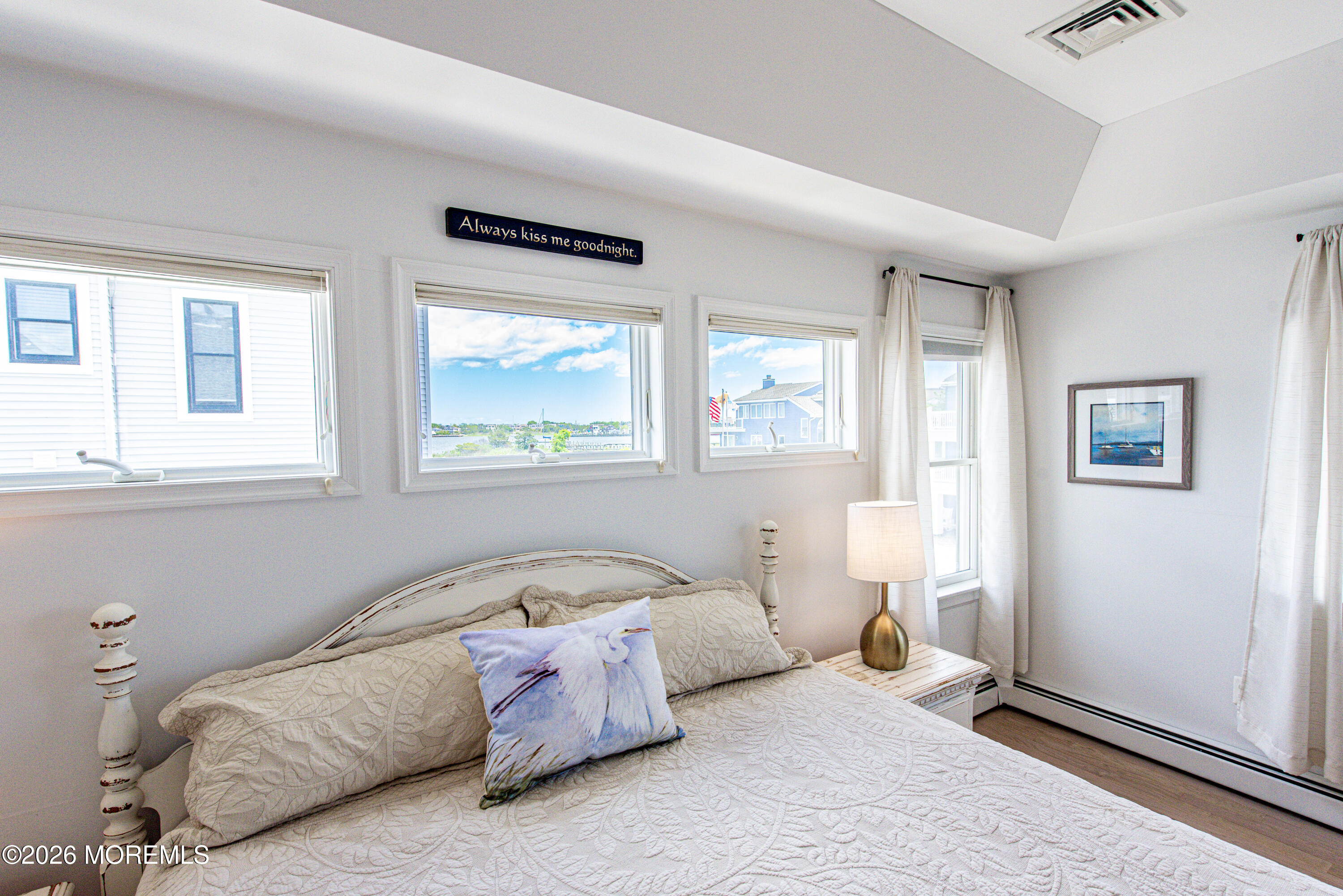 5 A Sunset Boulevard Barnegat Light, NJ 08006 - Photo 21 of 65 a bedroom with a bed and a window