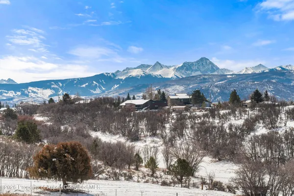 a view of a house with a backyard of the house