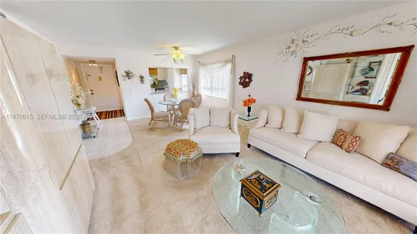 a living room with furniture and a table