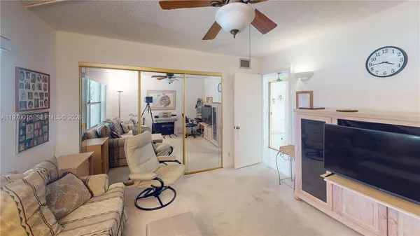 a view of a livingroom with furniture and window