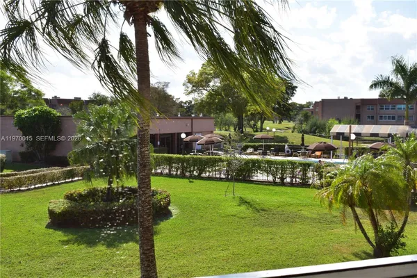 a view of a garden with a house