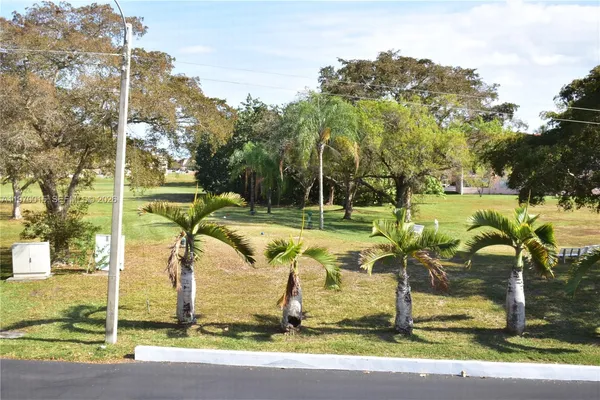 a view of a park with swings