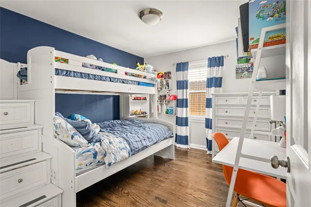 a bedroom with a bed and a bookshelf