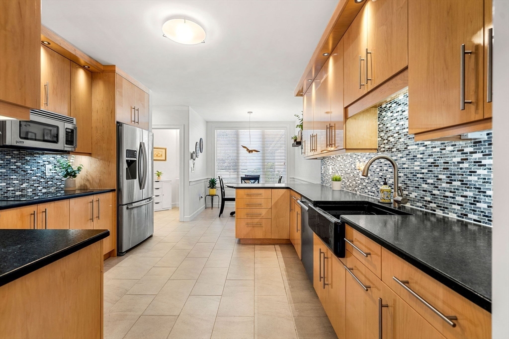 12 Highwood Lane Ipswich, MA 01938 - Photo 15 of 42 a kitchen with stainless steel appliances granite countertop a sink and cabinets