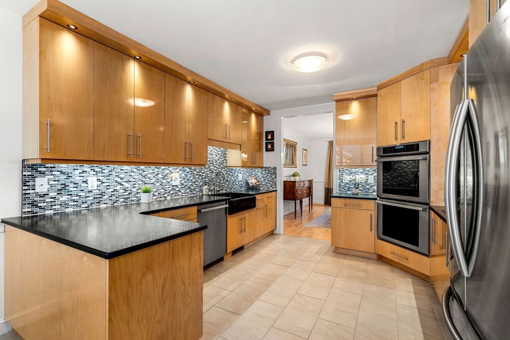 12 Highwood Lane Ipswich, MA 01938 - Photo 16 of 42 a kitchen with stainless steel appliances granite countertop a sink and a refrigerator