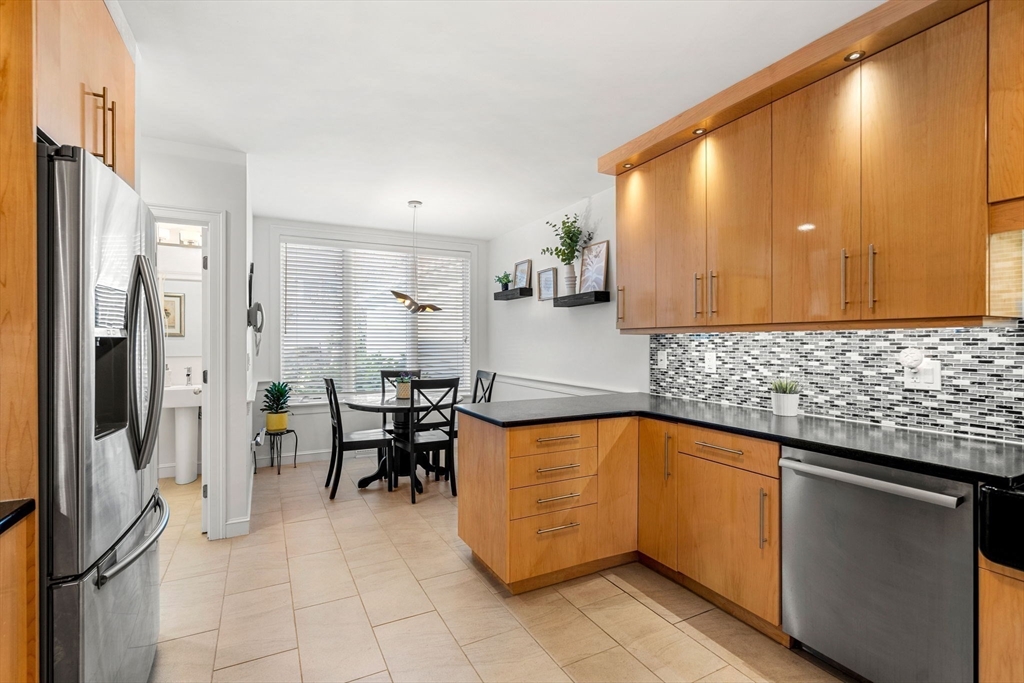 12 Highwood Lane Ipswich, MA 01938 - Photo 17 of 42 a kitchen with stainless steel appliances granite countertop a sink and cabinets