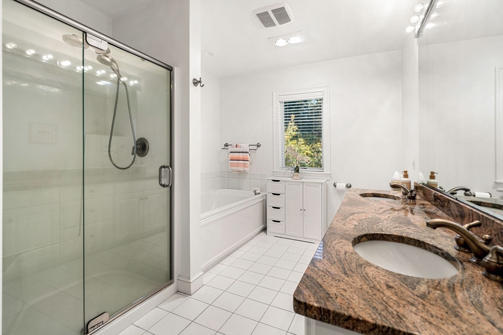 12 Highwood Lane Ipswich, MA 01938 - Photo 24 of 42 a en suite bathroom with a granite countertop tub sink a mirror and shower