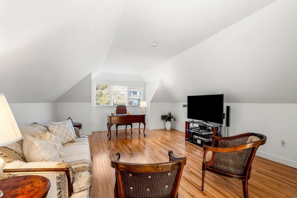 12 Highwood Lane Ipswich, MA 01938 - Photo 26 of 42 a living room with furniture and a flat screen tv