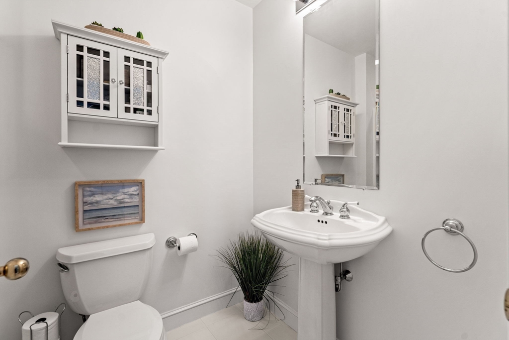 12 Highwood Lane Ipswich, MA 01938 - Photo 29 of 42 a bathroom with a toilet sink and mirror