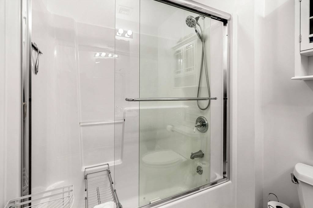 12 Highwood Lane Ipswich, MA 01938 - Photo 30 of 42 a bathroom with a glass shower door