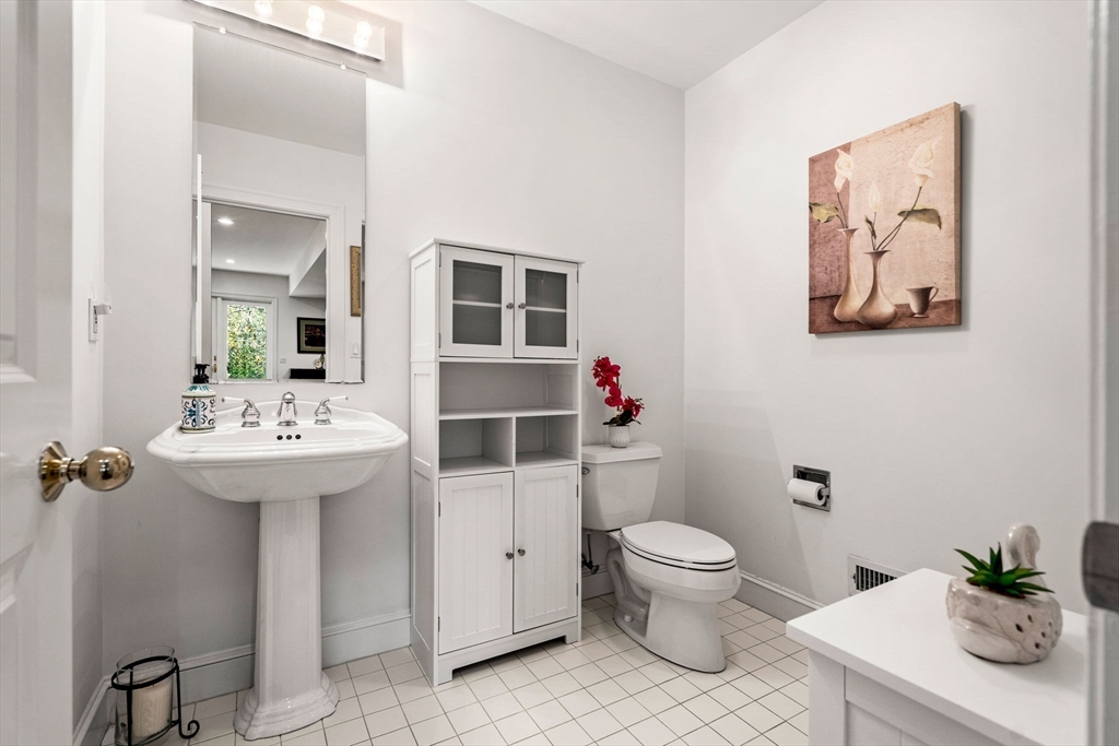 12 Highwood Lane Ipswich, MA 01938 - Photo 35 of 42 a bathroom with a toilet sink and mirror