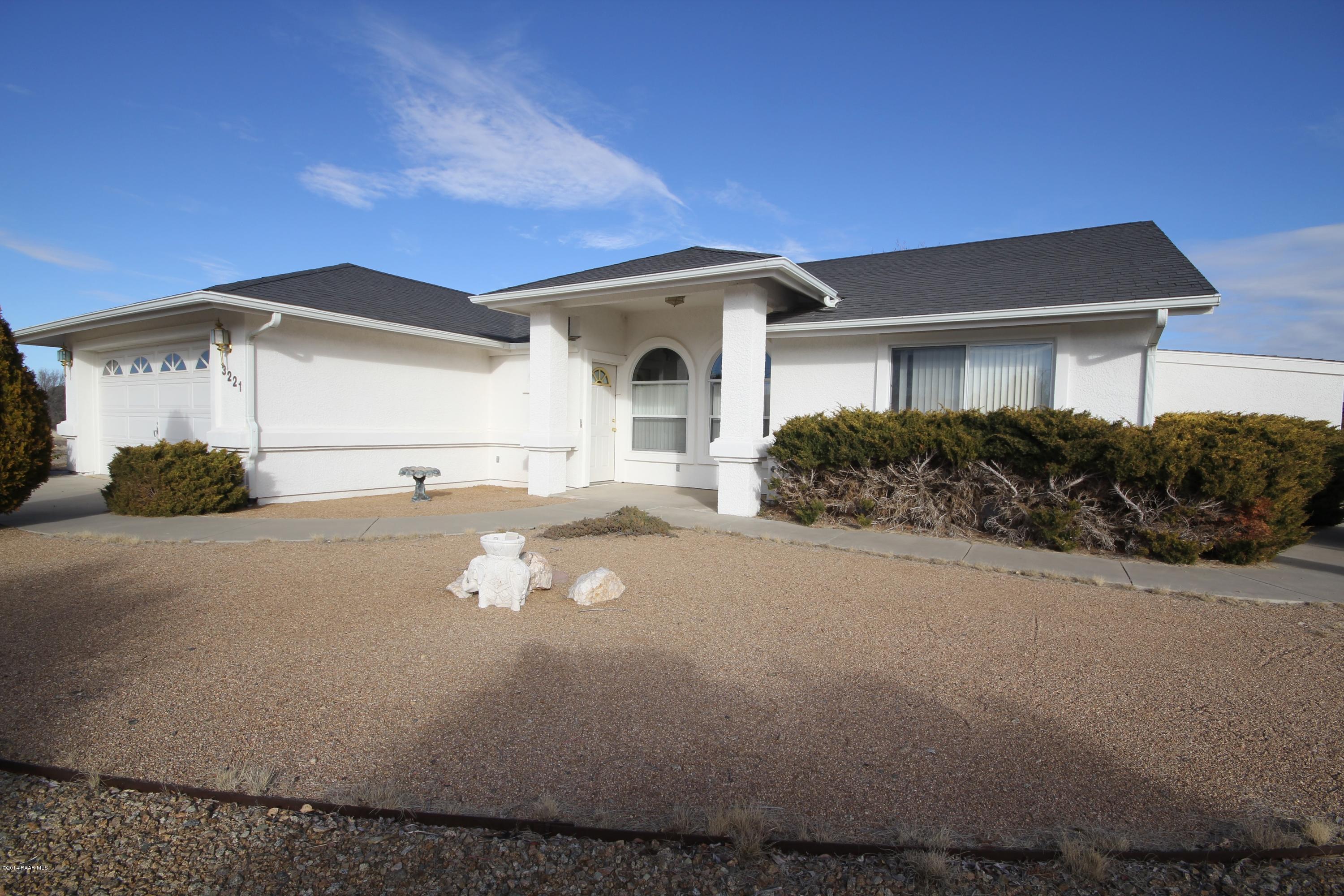 3221 North Reed Road Chino Valley, AZ 86323 - Photo 1 of 24 a front view of a house with a yard
