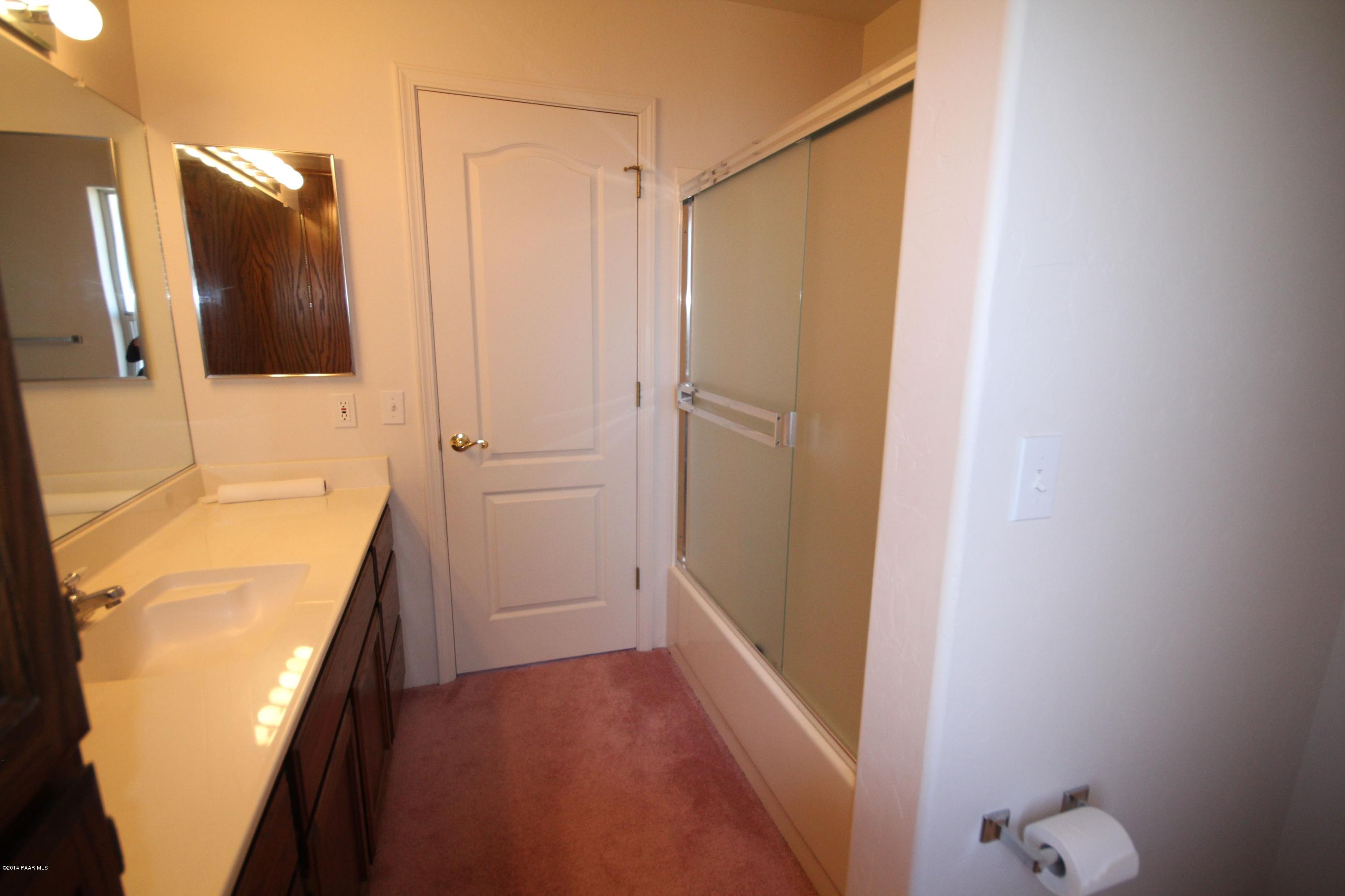 3221 North Reed Road Chino Valley, AZ 86323 - Photo 11 of 24 a bathroom with a bathtub and a shower
