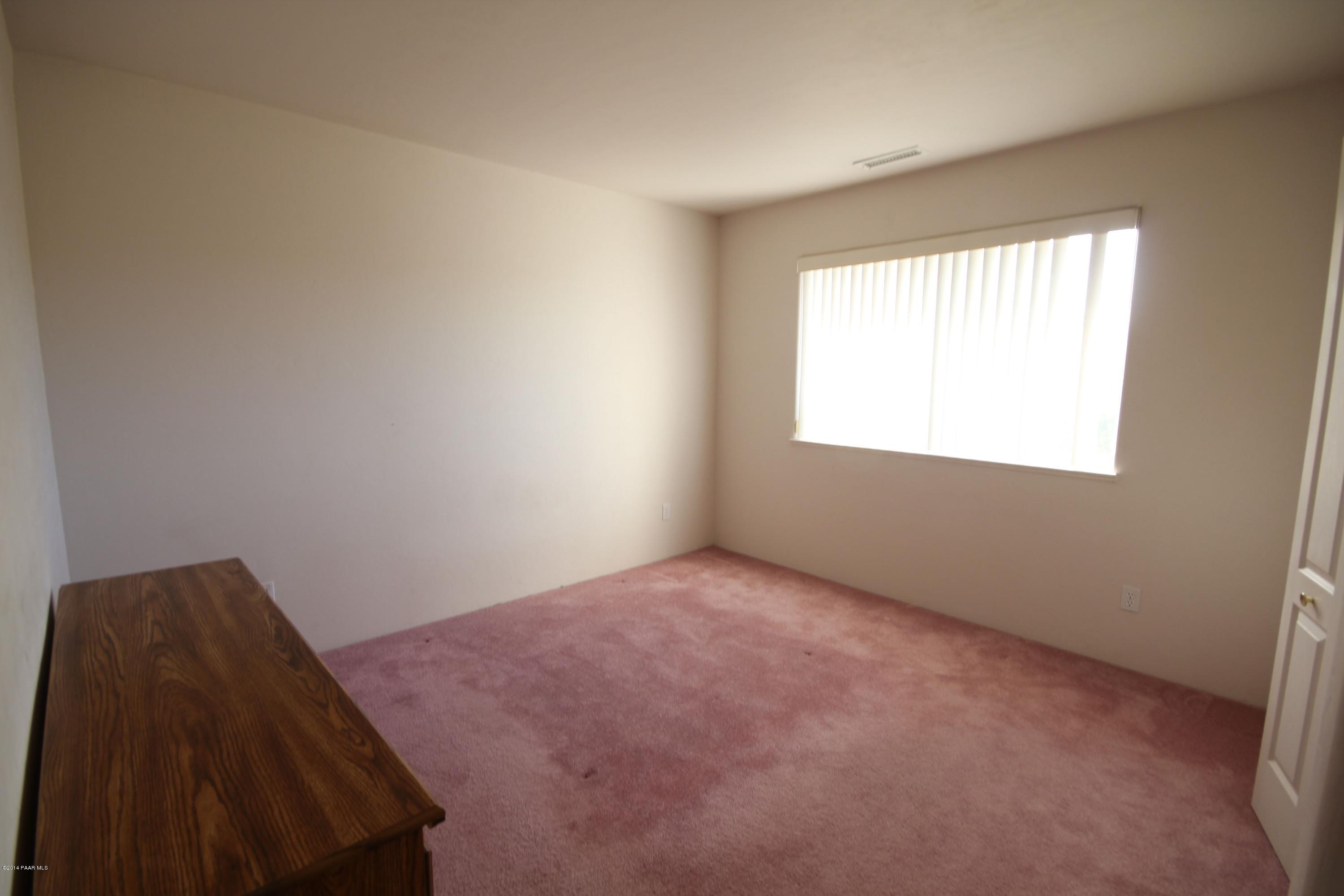 3221 North Reed Road Chino Valley, AZ 86323 - Photo 13 of 24 an empty room with a window