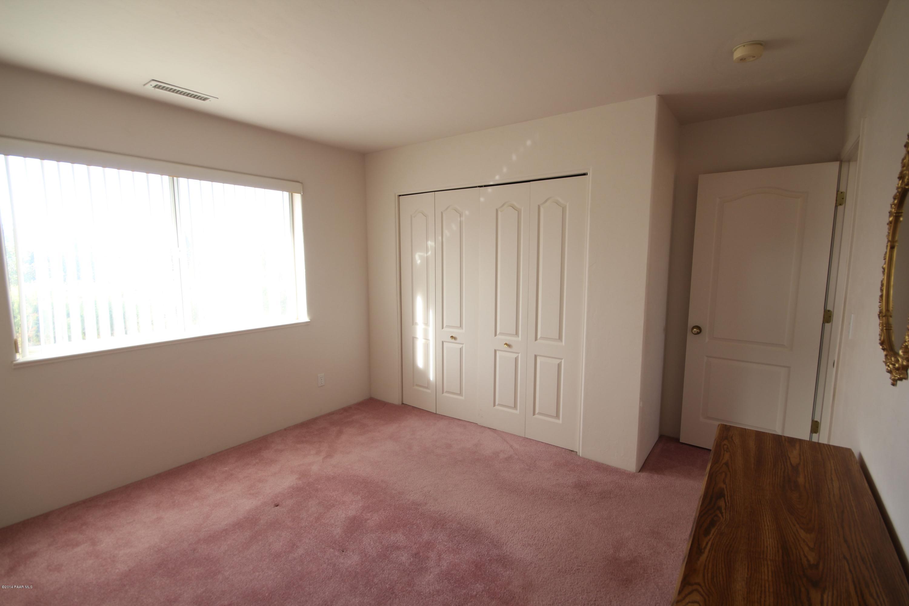 3221 North Reed Road Chino Valley, AZ 86323 - Photo 14 of 24 a view of an empty room with a window