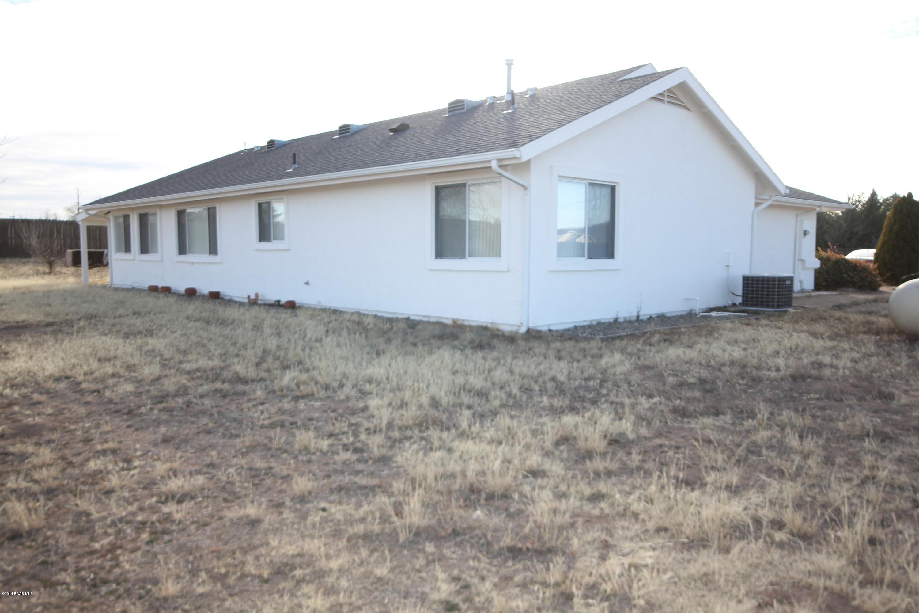 3221 North Reed Road Chino Valley, AZ 86323 - Photo 16 of 24 a view of a house with a backyard
