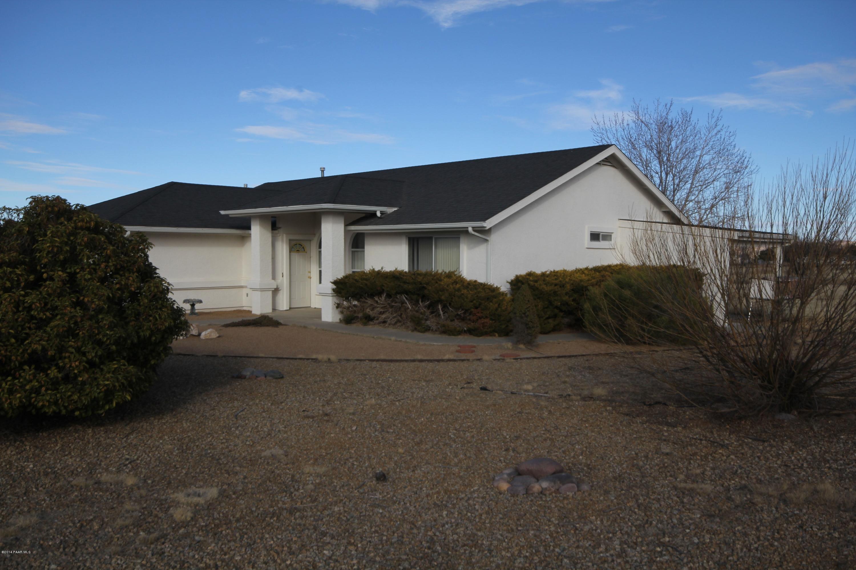3221 North Reed Road Chino Valley, AZ 86323 - Photo 17 of 24 a view of a house with a yard