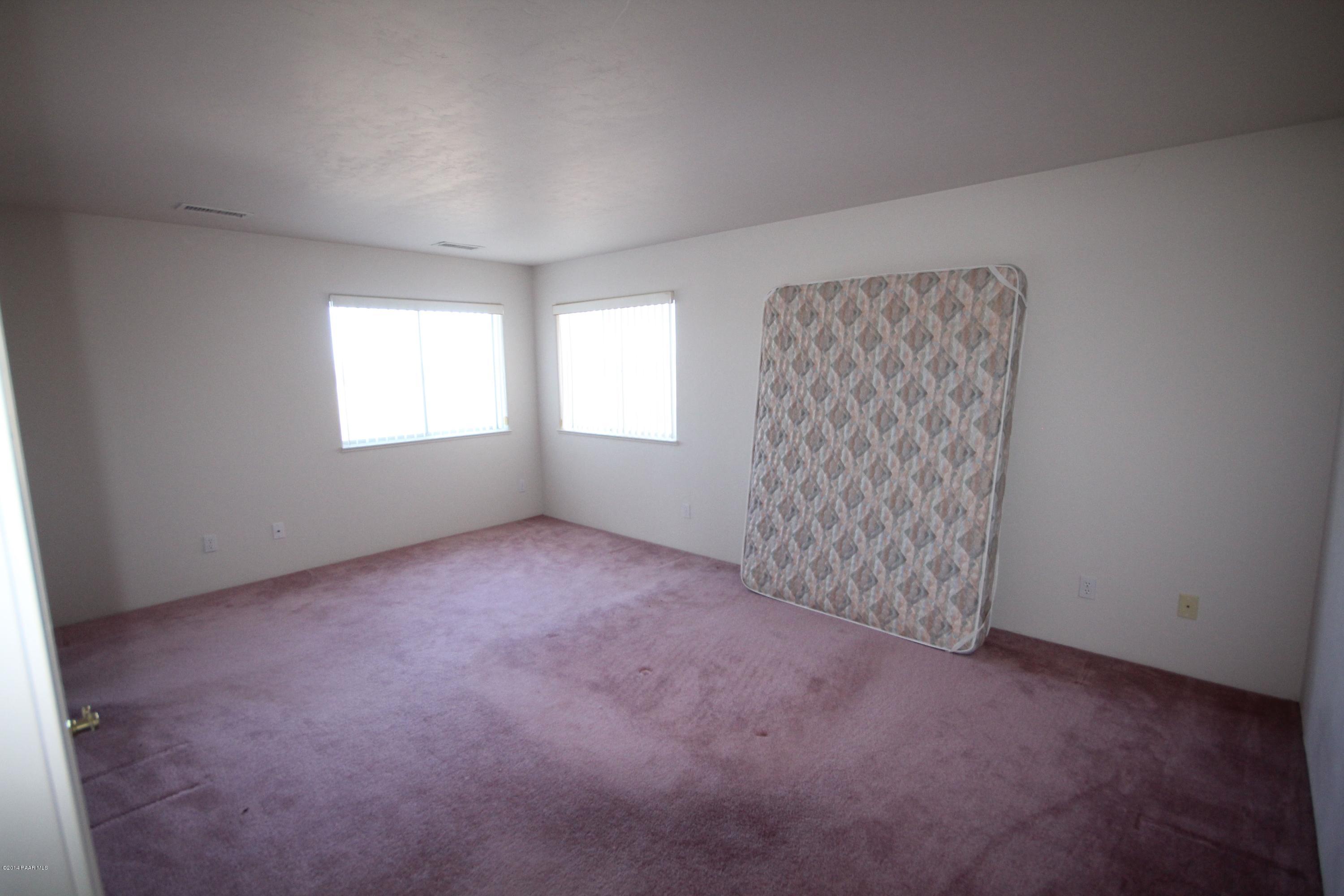 3221 North Reed Road Chino Valley, AZ 86323 - Photo 9 of 24 an empty room with windows