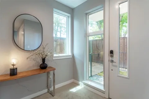 a view of a livingroom with furniture and windows