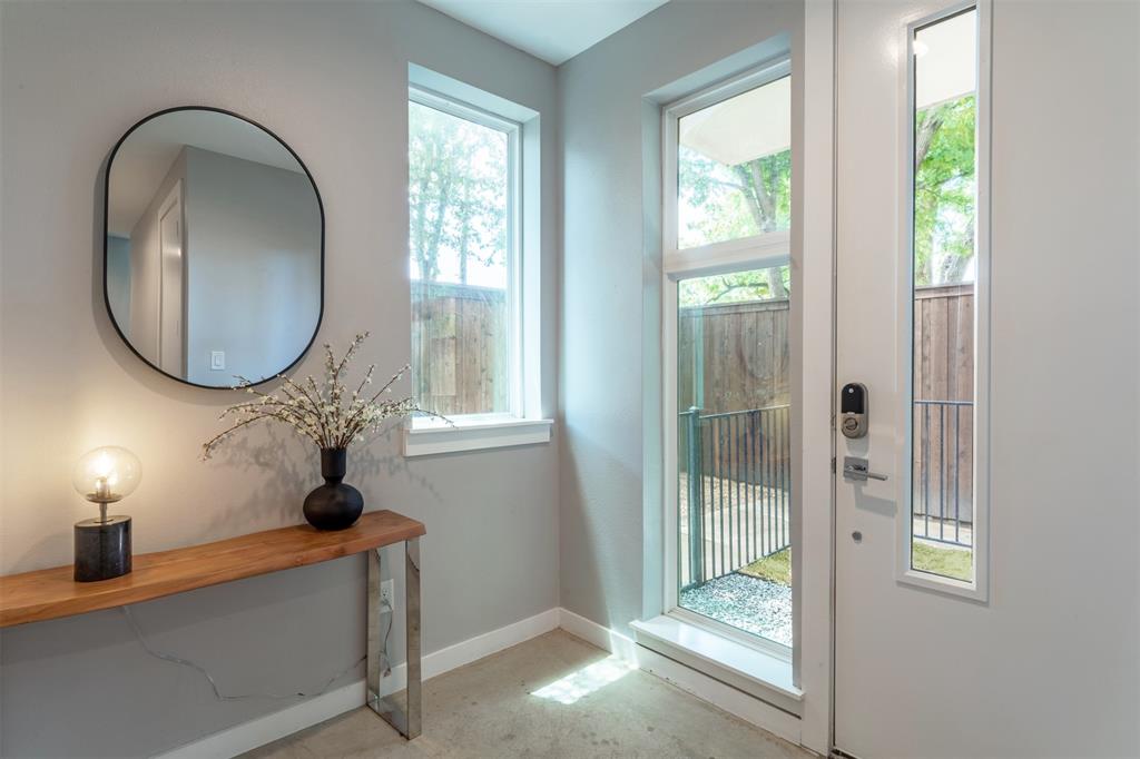 4620 Munger Avenue, Unit 107 Dallas, TX 75204 - Photo 21 of 28 a view of a livingroom with furniture and windows