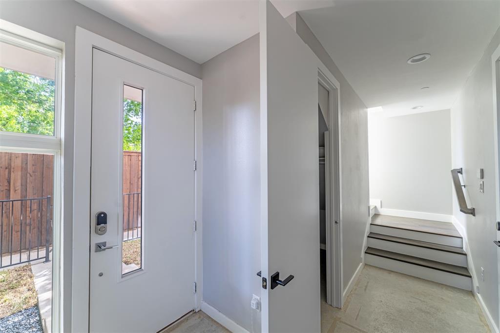 4620 Munger Avenue, Unit 107 Dallas, TX 75204 - Photo 22 of 28 a view of a hallway with wooden floor and entryway