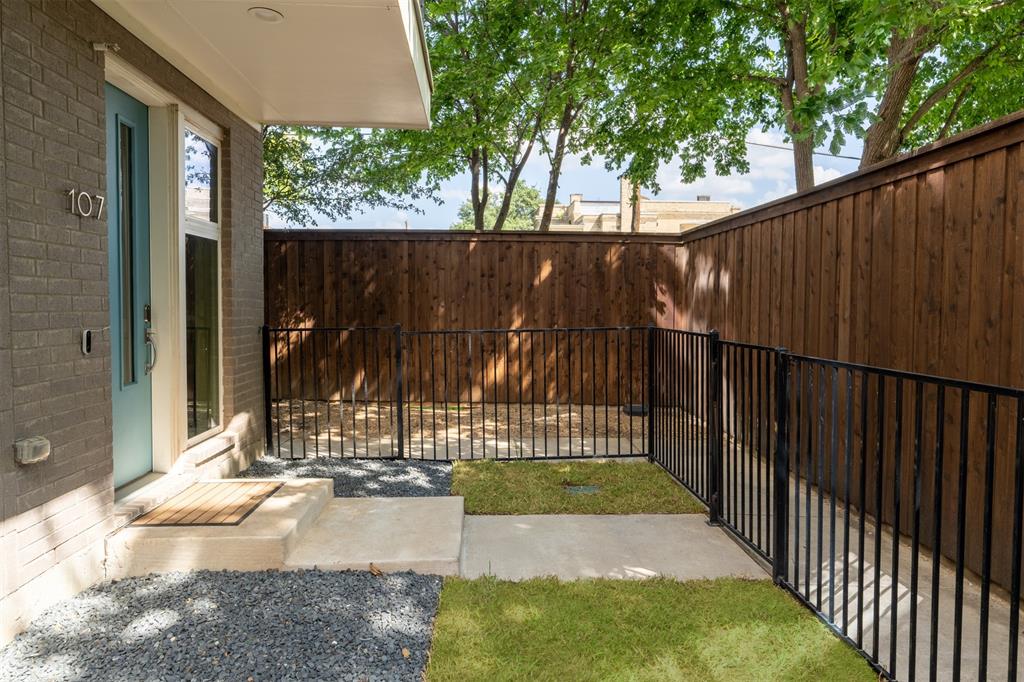 4620 Munger Avenue, Unit 107 Dallas, TX 75204 - Photo 24 of 28 a view of a backyard with a small cabin