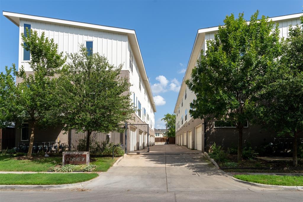 4620 Munger Avenue, Unit 107 Dallas, TX 75204 - Photo 26 of 28 front view of a house with a yard