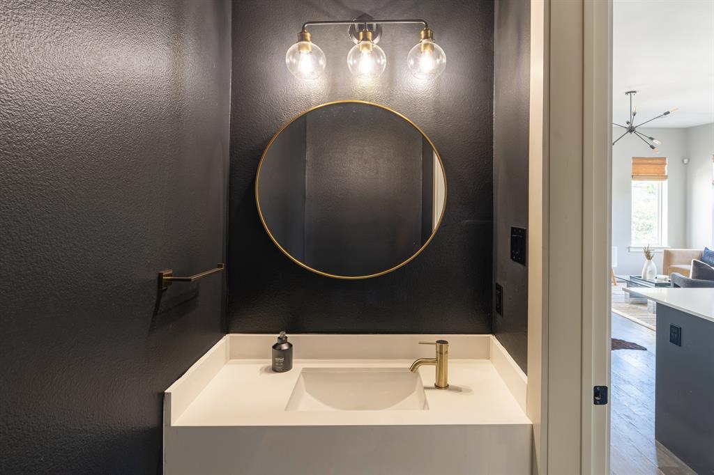 4620 Munger Avenue, Unit 107 Dallas, TX 75204 - Photo 10 of 28 a bathroom with a sink and a mirror