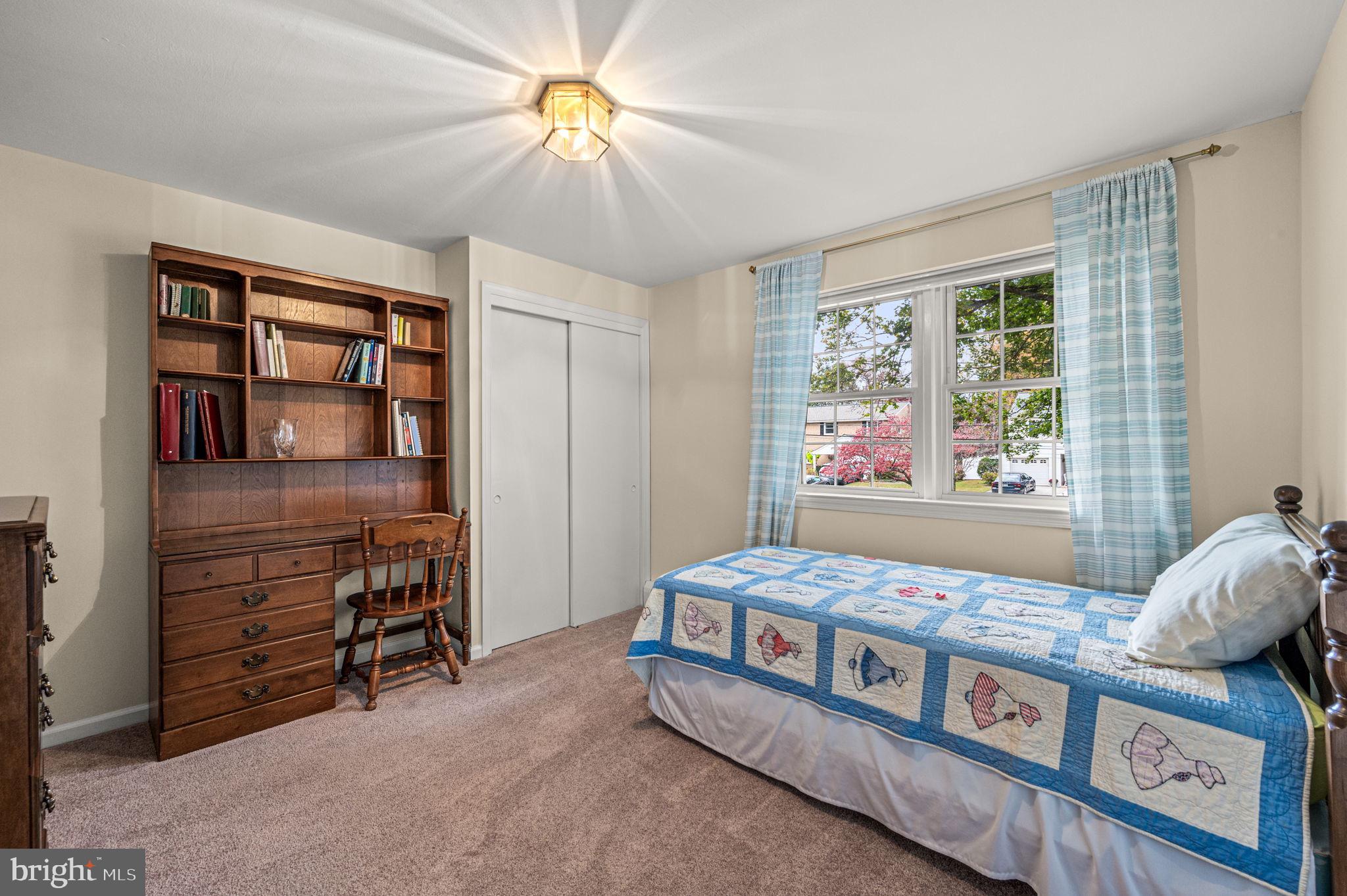 509 Lawrence Drive Springfield, PA 19064 - Photo 27 of 37 a bedroom with furniture and a window