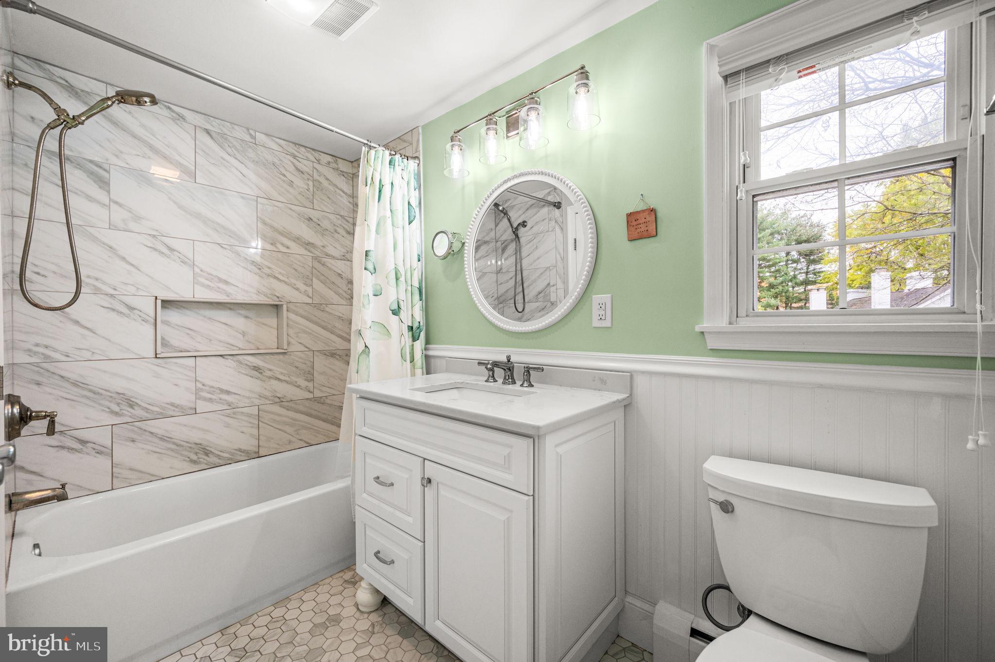 509 Lawrence Drive Springfield, PA 19064 - Photo 28 of 37 a bathroom with a sink a toilet and a bathtub